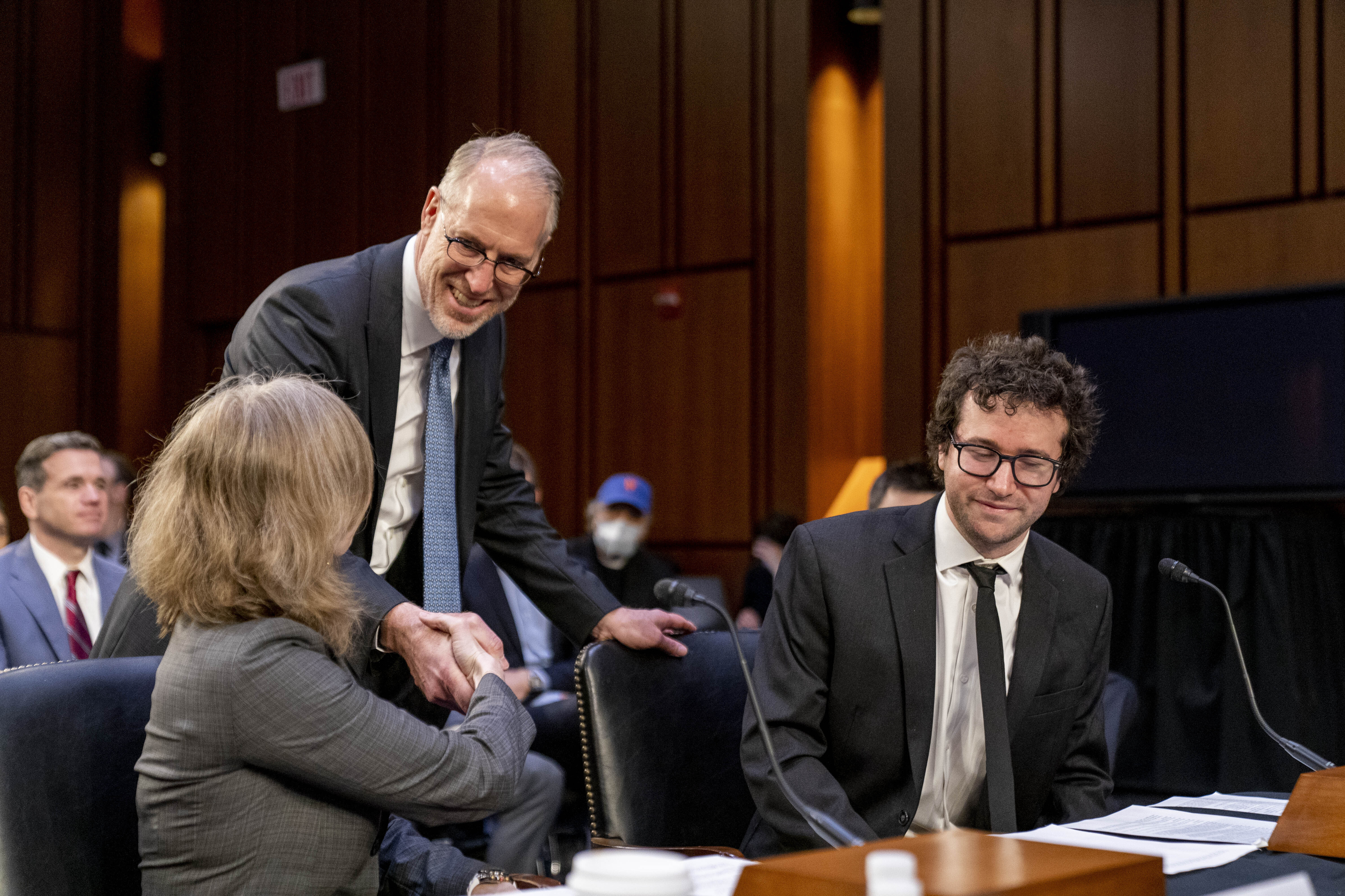 From left, American Antitrust Institute Vice President For Legal Advocacy Kathleen Bradish, Live Nation Entertainment, Inc. President and Chief Financial Officer Joe Berchtold, and Singer-Songwriter Clyde Lawrence arrive to testify before a Senate Judiciary Committee hearing to examine promoting competition and protecting consumers in live entertainment on Capitol Hill in Washington, Tuesday, Jan. 24, 2023. (AP Photo/Andrew Harnik)