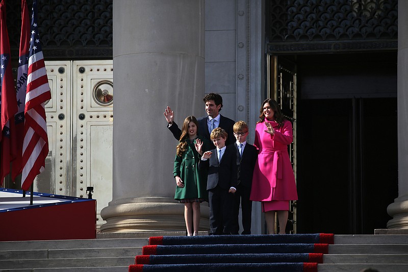 First Gentleman Brian Sanders (left) walks out the Capitol doors with his family, Gov. Sarah Huckabee Sanders and kids, Scarlett (from left) George, and Huck during Sanders' inauguration ceremony on Tuesday, Jan. 10, 2023, at the state Capitol in Little Rock. More photos at www.arkansasonline.com/111Sanders/.(Arkansas Democrat-Gazette/Thomas Metthe)