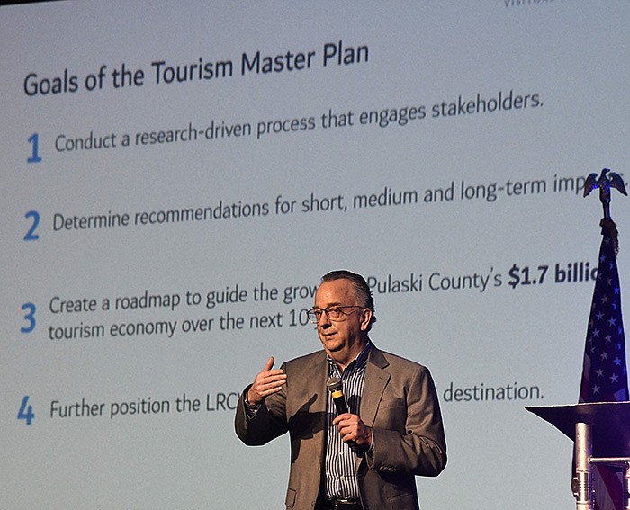 Dan Fenton, executive vice president of Jones Lang LaSalle, a hospitality industry consultant firm, explains the 2023 tourism master plan for the Little Rock Convention and Visitors Bureau during a presentation at the Statehouse Convention Center on Wednesday.
(Arkansas Democrat-Gazette/Stephen Swofford)