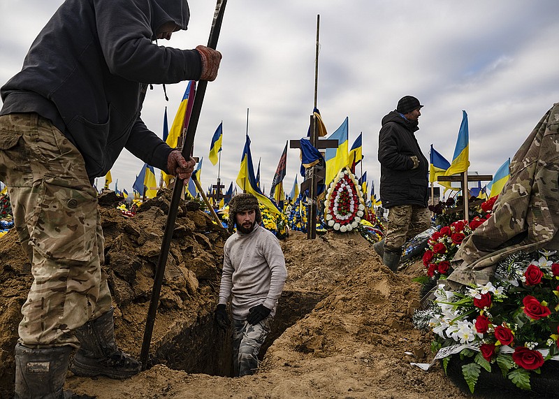 In anticipation of more military funerals, workers prepare graves Wednesday at a cemetery in Kharkiv in northeastern Ukraine in “The Valley of Glory,” a section of the cemetery reserved for the military. Russia launched missile attacks Tuesday and Wednesday that struck settlements in the Kharkiv region.
(The New York Times/Lynsey Addario)