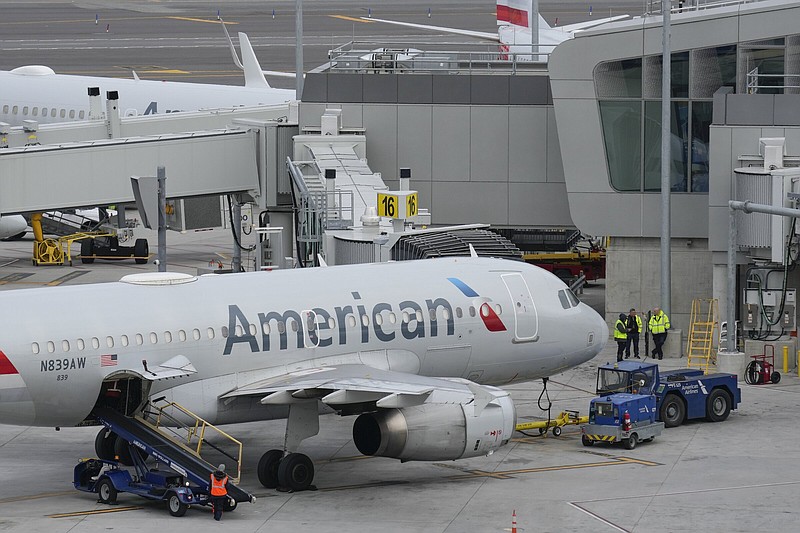 American Airlines jets are parked at Terminal B at LaGuardia Airport in New York earlier this month. The airline posted a better-than-expected profit for the fourth quarter.
(AP)