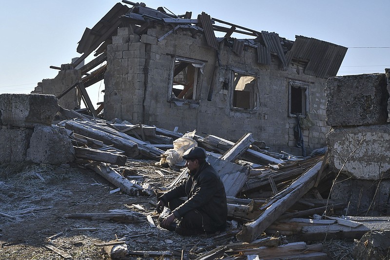 A Ukrainian sits near the ruins of his house Thursday in Zaporizhzhya after it was hit during a Russian rocket attack. The regional prosecutor’s office in Zaporizhzhia province said three people were killed and seven injured in the strike aimed at an energy facility.
(AP/Andriy Andriyenko)