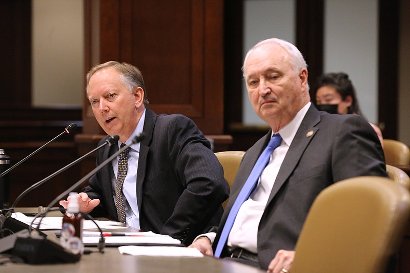 Then-state budget director Robert Brech (left) answers a question at the state Capitol in Little Rock in this Jan. 11, 2022 file photo as Larry Walther, secretary of the Department of Finance and Administration, listens at right. Walther said Friday, Jan. 27, 2023 that Brech has been promoted to deputy director of budget at the finance department. (Arkansas Democrat-Gazette/Thomas Metthe)