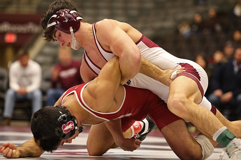 UALR's Joseph Bianchi, top, wrestles Stanford's Luciano Arroyo during a dual at the Jack Stephens Center on the UALR campus on Saturday, Jan. 28, 2023. See more photos at arkansasonline.com/129wrestling/ (Arkansas Democrat-Gazette/Colin Murphey)