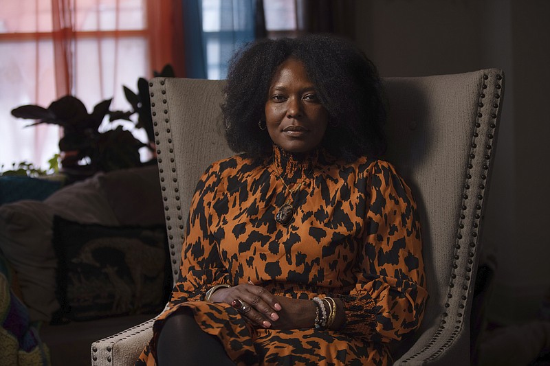 Zeneta Everhart poses for a portrait in her home in Buffalo, N.Y., on Jan. 27, 2023. Everhart's son, Zaire Goodman, survived a shooting at a Tops supermarket in Buffalo, New York last May. “You know, we don’t want to hear about this. We don’t want to hear about our children dying by gun violence, and we don’t want to hear about our seniors” who were killed in the California studio attack. “How awful. How heartbreaking.” (AP Photo/Robert Bumsted)