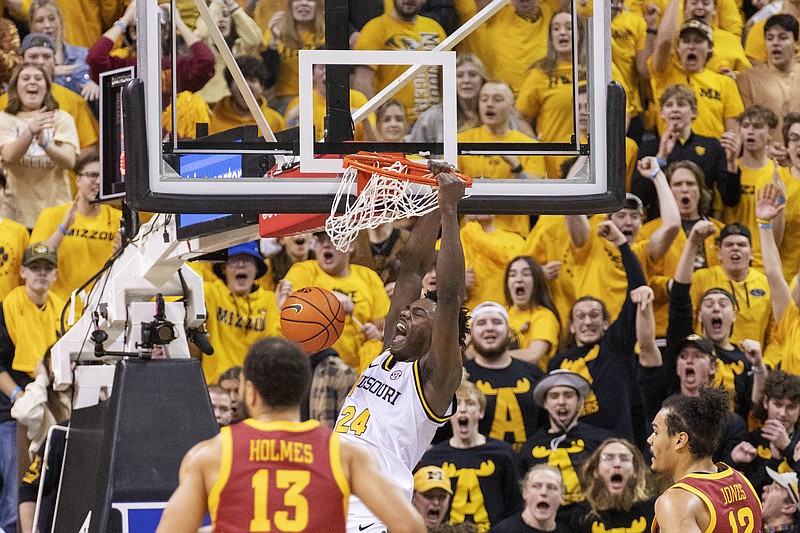 Kobe Brown of Missouri celebrates as he dunks the ball during Saturday afternoon’s game against Iowa State at Mizzou Arena in Columbia. (Associated Press)