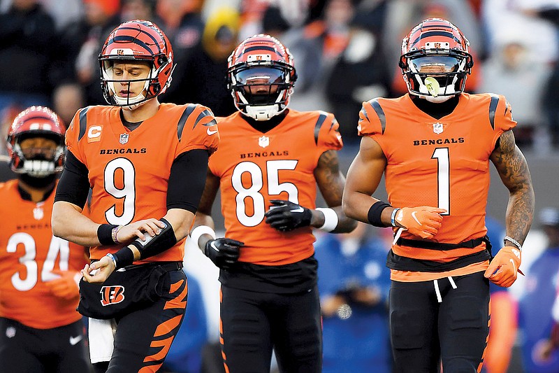 In this Dec. 4, 2022, file photo, (from left) Bengals quarterback Joe Burrow and wide receivers Tee Higgins and Ja’Marr Chase run onto the field during a game against the Chiefs in Cincinnati. (Associated Press)