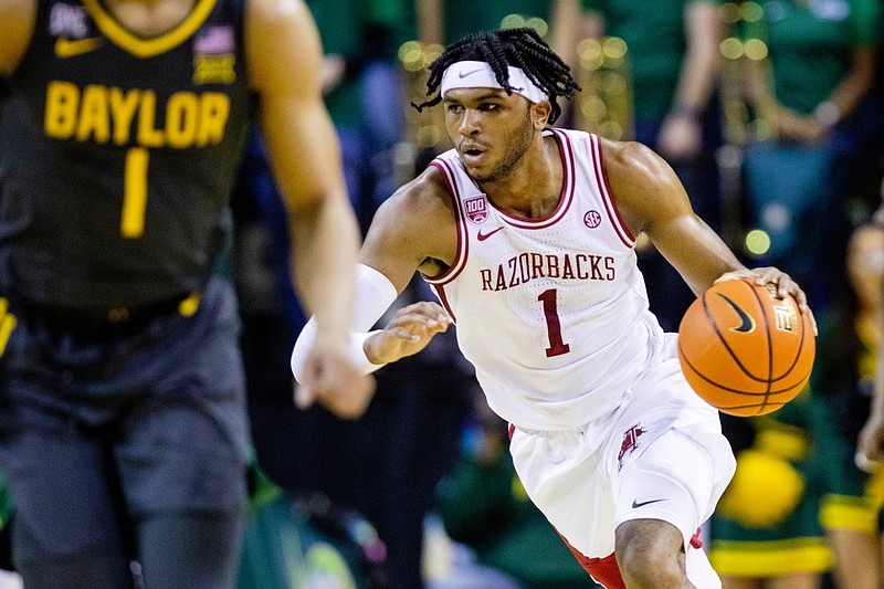 Arkansas guard Ricky Council IV drives the ball down the court during the first half of a game against Baylor in Waco, Texas, on Saturday, Jan. 28, 2023. (AP Photo/Gareth Patterson)