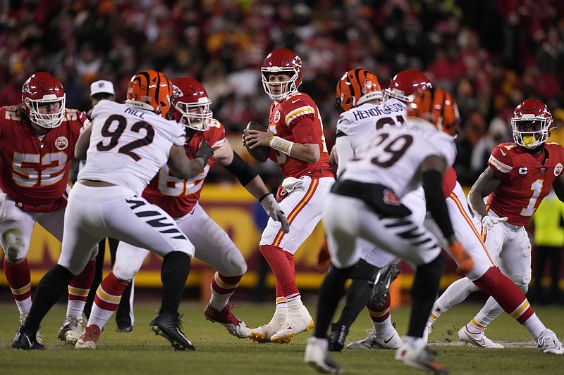 Kansas City Chiefs quarterback Patrick Mahomes (15) works in the pocket against the Cincinnati Bengals during the first half of the NFL AFC Championship playoff football game, Sunday, Jan. 29, 2023, in Kansas City, Mo. (AP Photo/Jeff Roberson)