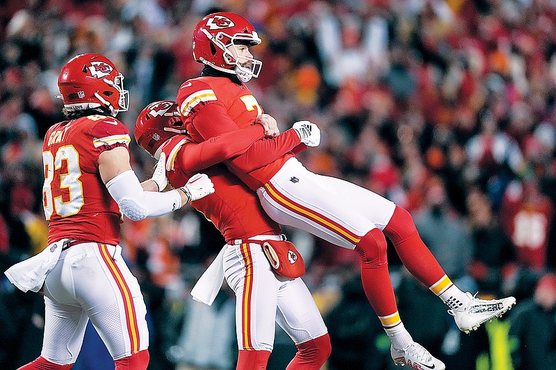 Chiefs kicker Harrison Butker is lifted in the air Sunday night after his game-winning field goal against the Bengals in the final seconds of the AFC Championship Game at Arrowhead Stadium in Kansas City. (Associated Press)