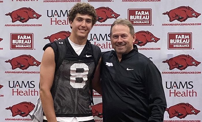 Arkansas commitment Max Schmidly and special teams coach Scott Fountain during his visit to Fayetteville last summer.