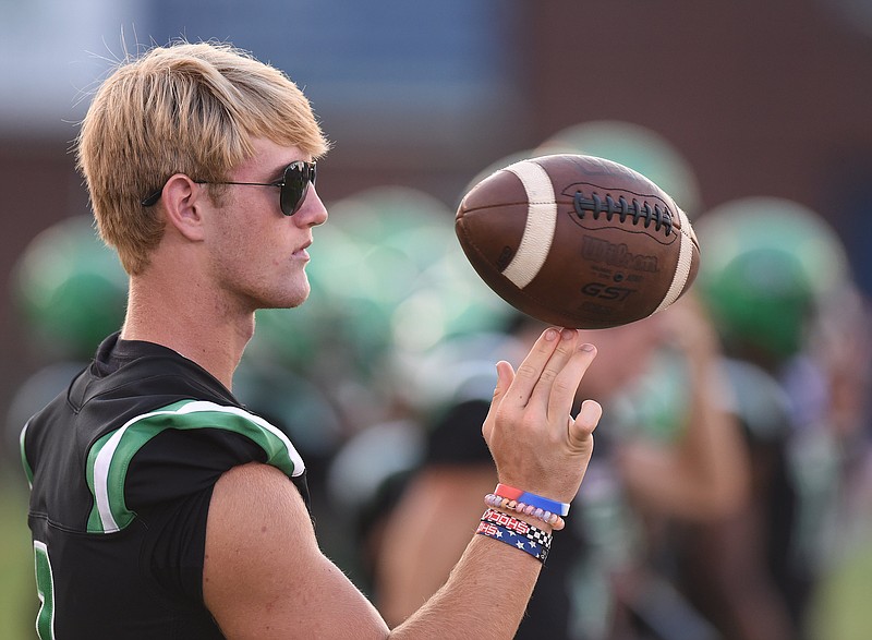 Staff file photo by Matt Hamilton / East Hamilton quarterback Lake Clark overcame a knee injury that prevented him from playing his senior high school season to earn scholarship offers from multiple college programs. Clark signed with Emory & Henry on Wednesday, the traditional national signing day for prep football players.