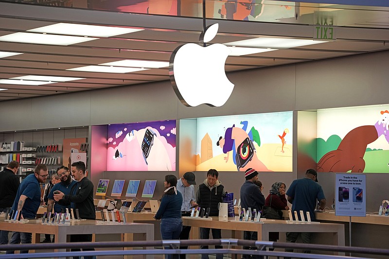 Customers shop in an Apple store in Pittsburgh on Monday.
(AP/Gene J. Puskar)