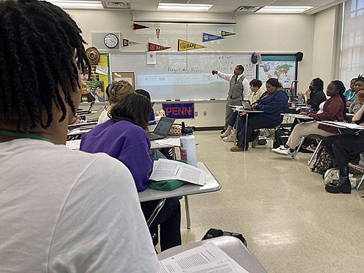 Emmitt Glynn teaches AP African American studies to a group of students Monday at a magnet school in Baton Rouge. Glynn said so many students were interested in the course that he expanded it to two classes instead of one as he had originally planned.
(AP/Stephen Smith)