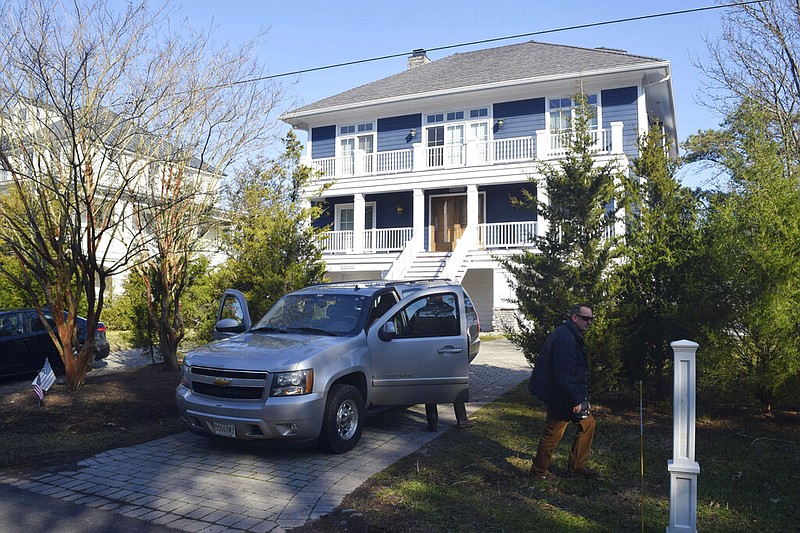 FILE - U.S. Secret Service agents are seen in front of Joe Biden's Rehoboth Beach, Del., home on Jan. 12, 2021. The FBI is conducting a planned search of President Joe Biden’s Rehoboth Beach, Delaware home as part of its investigation into the potential mishandling of classified documents. That's according to a statement from Biden's personal lawyer. (Shannon McNaught/Delaware News Journal via AP, File)