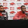 Arkansas assistant coaches Deron Wilson (left) and Marcus Woodson speak Wednesday, Feb. 1, 2023, during a press conference at the Frank Broyles Athletic Center on the University of Arkansas campus in Fayetteville.