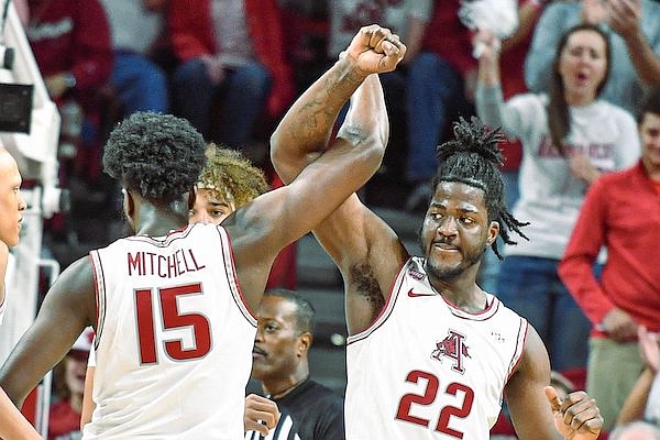 Arkansas centers Makhi Mitchell (15) and Makhel Mitchell (22) are shown during a game against Alabama on Wednesday, Jan. 11, 2023, in Fayetteville.
