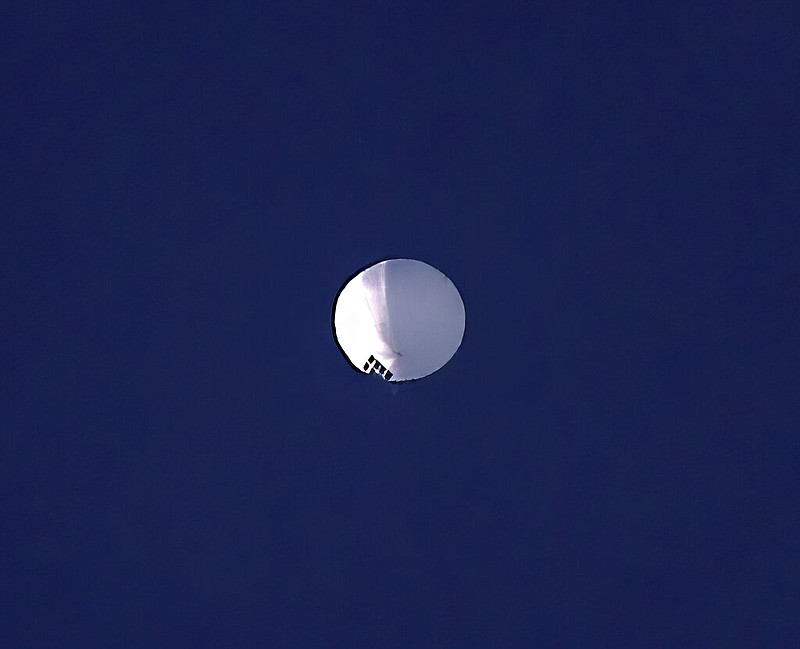 A high-altitude balloon floats over Billings, Mont., on Wednesday, Feb. 1, 2023. The Pentagon would not confirm on Thursday, Feb. 2, 2023 that the balloon in the photo is a suspected Chinese surveillance balloon that has been spotted over U.S. airspace. The Pentagon decided not to shoot the balloon down due to risks of harm for people on the ground, officials said Thursday. (Larry Mayer/The Billings Gazette via AP)