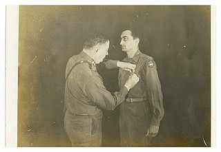 Contributed Photo by Deborah Levine / Aaron Levine, right, is shown being given a medal for his service during World War II.