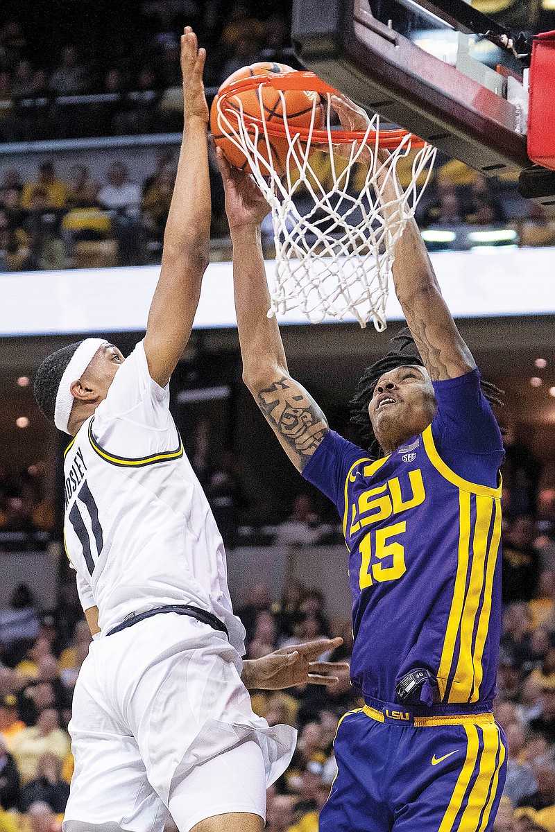 Isiaih Mosley of Missouri blocks the shot of LSU’s Tyrell Ward during Wednesday night’s game at Mizzou Arena in Columbia. (Associated Press)