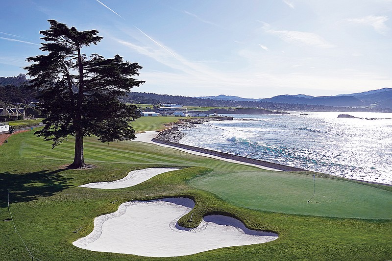 Waves roll in along the 18th hole of the Pebble Beach Golf Links during Wednesday's practice round of the AT&T Pebble Beach Pro-Am in Pebble Beach, Calif. (Associated Press)