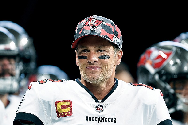 Buccaneers quarterback Tom Brady smiles during warmups before the regular-season finale against the Falcons last month in Atlanta. (Associated Press)