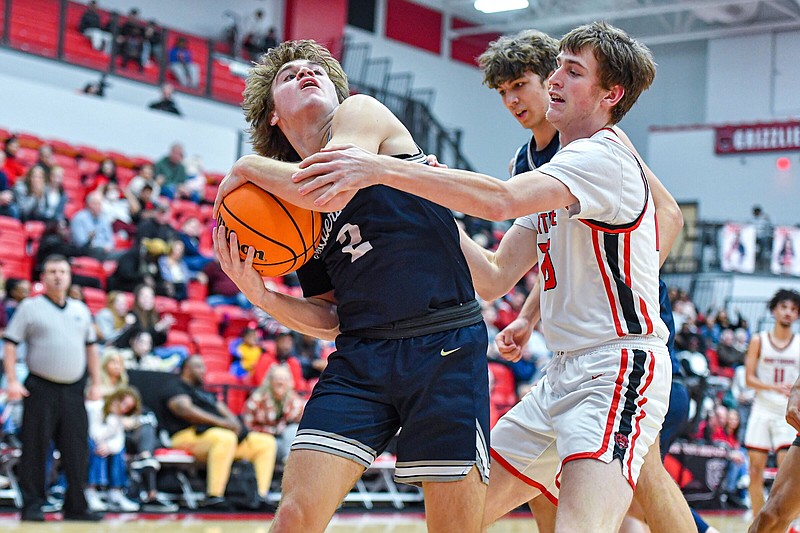 Bentonville West’s Tucker Bowman (2) drives as Fort Smith Northside’s Luke Young defends during the first quarter Friday at Northside Arena in Fort Smith. 
(NWA Democrat-Gazette/Hank Layton)