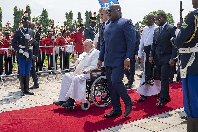 Pope Francis waves Friday as he departs for South Sudan from Kinshasa, Congo. More photos at arkansasonline.com/204pope/.
(AP/Jerome Delay)