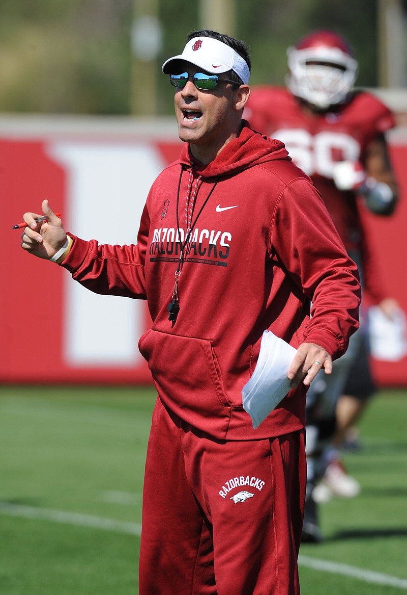 New Arkansas offensive coordinator Dan Enos, seen here during a 2017 spring practice, said his head coaching experience makes him a better assistant. He said he can use his experience to anticipate situations and help the head coach.
(NWA Democrat-Gazette/Andy Shupe)