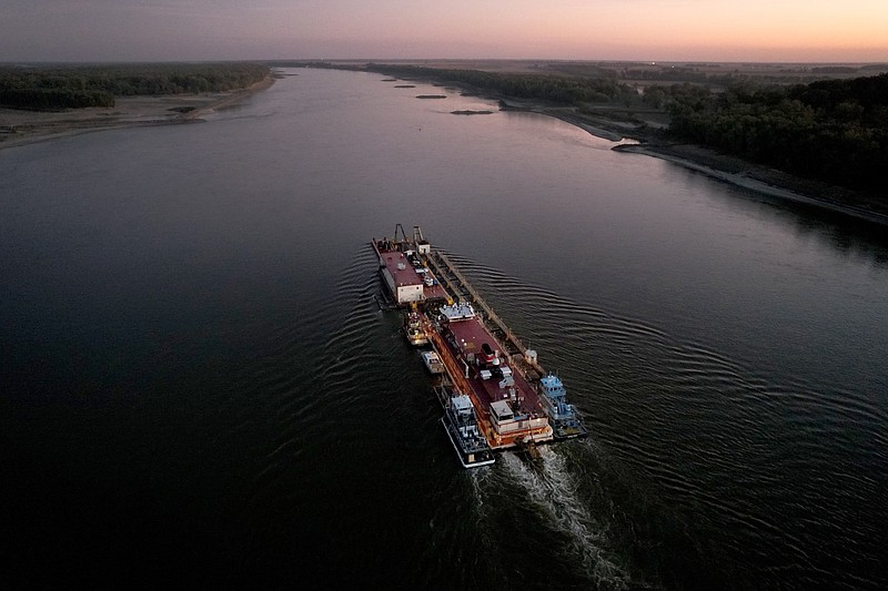 FILE - Dredge Jadwin, a U.S. Army Corps of Engineers dredging vessel, powers south down the Mississippi River Wednesday, Oct. 19, 2022, past Commerce, Mo. Amid a major drought in the Western U.S., a proposed solution comes up repeatedly: large-scale river diversions, including pumping Mississippi River water to parched states. (AP Photo/Jeff Roberson)