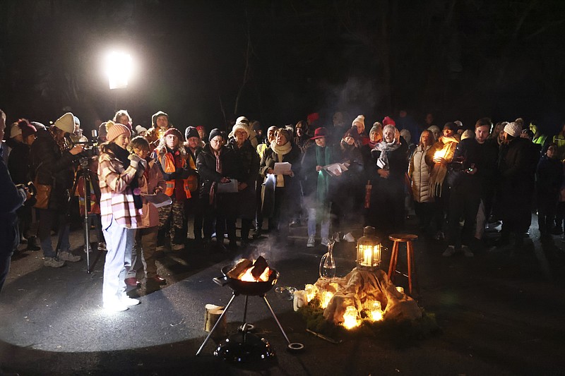 People participate in a candlelight pilgrimage walk, which makes its way past an ancient well associated with St Brigid, to the Solas Bhride Centre in Kildare, Ireland, Tuesday, Jan. 31, 2023. St. Brigid of Kildare, a younger contemporary of St. Patrick, is quietly and steadily gaining a following, in Ireland and abroad. Devotees see Brigid, and the ancient Irish goddess whose name and attributes she shares, as emblematic of feminine spirituality and empowerment. (AP Photo/Peter Morrison)