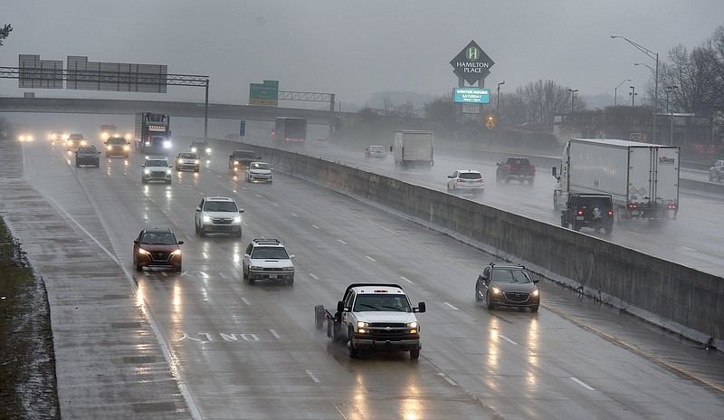 Staff photo by Matt Hamilton / Traffic moves through the rain on I-75 near the Hamilton Place Mall on Thursday, February 2, 2023.