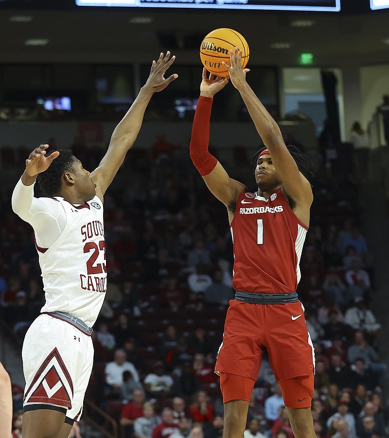 February 4, 2023:  Arkansas junior Ricky Council IV (1) takes 3 point shot over South Carolina freshman Gregory Jackson II (23).  NCAA basketball game between University of Arkansas vs University of South Carolina at Colonial Life Arena,  Columbia, SC.  .Special to NWADG/David Beach