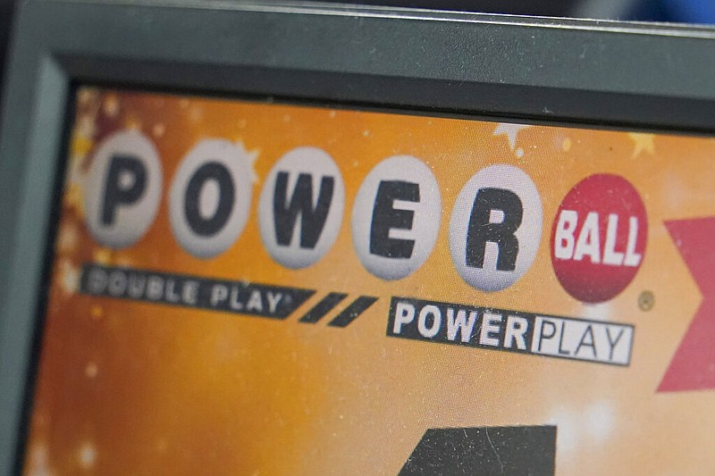FILE - A display panel advertises tickets for a Powerball drawing at a convenience store, Nov. 7, 2022, in Renfrew, Pa. (AP/Keith Srakocic, File)