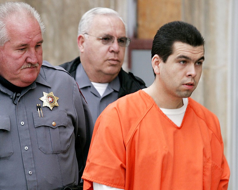 FILE - Anthony Sanchez, right, is escorted into a Cleveland County courtroom for a preliminary hearing in Norman, Okla., on Feb. 23, 2005.  (Jaconna Aguirre/The Oklahoman via AP, File)