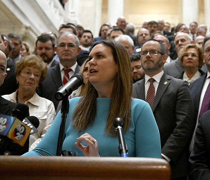 Lawmakers, students, parents and teachers gather around Gov. Sarah Huckabee Sanders as she announces her education plan Wednesday at the state Capitol.
(Arkansas Democrat-Gazette/Stephen Swofford)