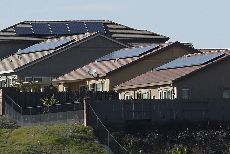 FILE - Solar panels on rooftops of a housing development in Folsom, Calif., Feb. 12, 2020. (AP Photo/Rich Pedroncelli, File)