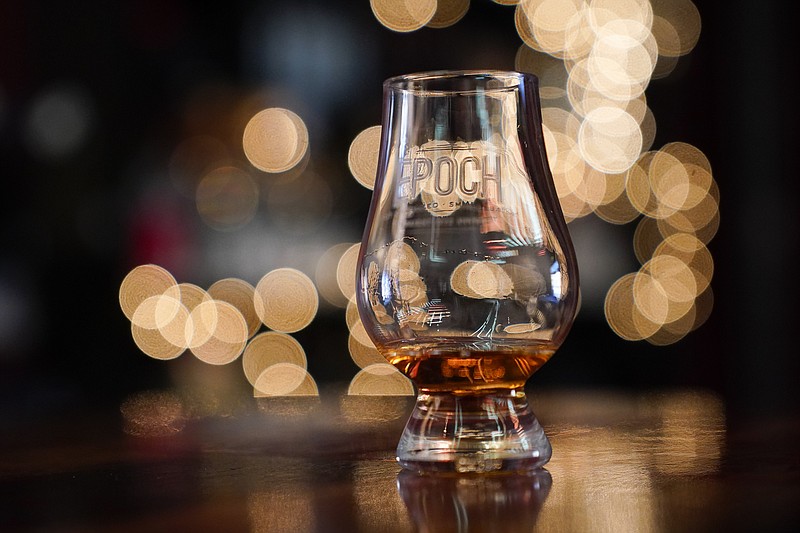 A glass containing rye whiskey is seen at the cocktail lounge at Baltimore Spirits Company, Wednesday, Feb. 8, 2023, in Baltimore. Spirits have surpassed beer for U.S. market share supremacy, led by a resurgent cocktail culture — including the popularity of ready-to-drink concoctions, according to a spirits industry group. In 2022, spirits gained market share for the 13th straight year in the U.S. beverage alcohol market, with supplier sales reaching 42.1%, according to the Distilled Spirits Council of the United States. After years of steady growth, it marked the first time that spirits supplier revenues have surpassed beer, which holds a 41.9% market share, the group said. (AP Photo/Julio Cortez)