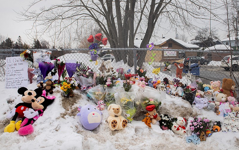 A memorial is shown at the site of a daycare centre in Laval, Quebec, Thursday, Feb. 9, 2023, where a bus crashed into the building killing two children. (Graham Hughes/The Canadian Press via AP)