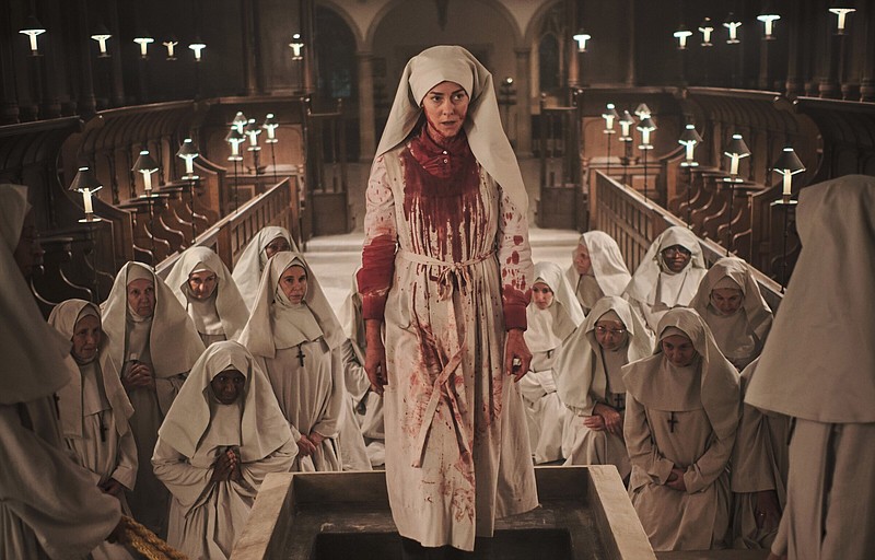 Bloody murder: devout atheist Grace (Jena Malone) is determined to prove her Catholic priest brother didn’t commit suicide and thereby consign himself to eternal damnation in Christopher Smith’s supernatural mystery “Consecration.”