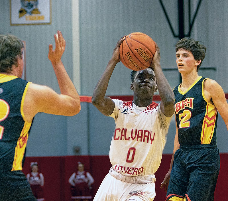 Calvary Lutheran's Kwesi Hall cuts to the basket during Thursday night’s game against Prairie Home/Bunceton at Calvary Lutheran High School. (Josh Cobb/News Tribune)