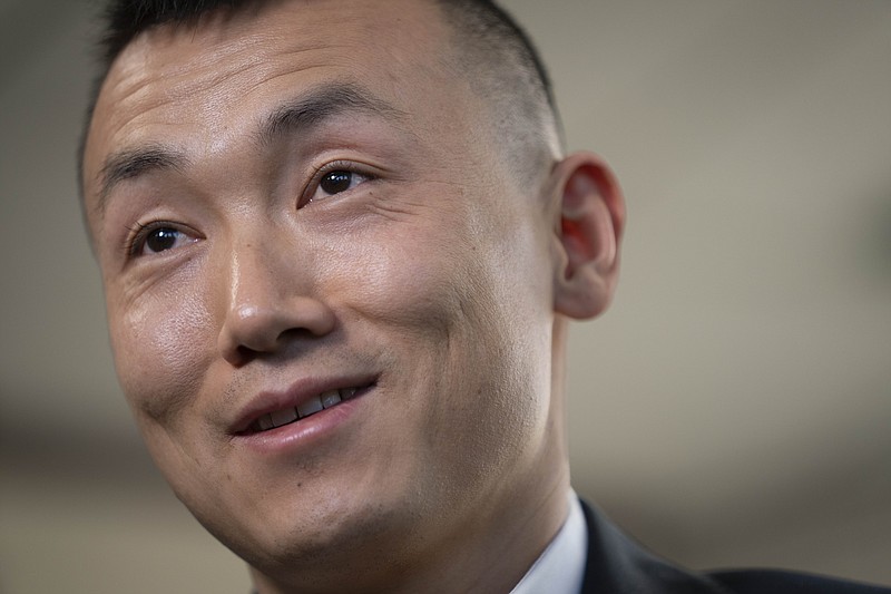 Baimadajie Angwang is interviewed at the Law Office of John F. Carman, Esq., Wednesday, Feb. 1, 2023, in Garden City, N.Y. In a few terrifying minutes nearly three years ago, Angwang's life took an abrupt turn — from a teenaged asylum seeker, U.S. Marine and NYPD officer to an accused spy for China. Last month the government dismissed charges against him without fully explaining why. (AP Photo/John Minchillo)