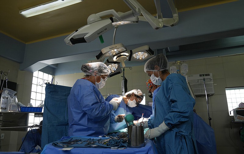 Cardiologists perform open-heart surgery in this Feb. 1, 2023 file photo. (AP/Juan Karita)