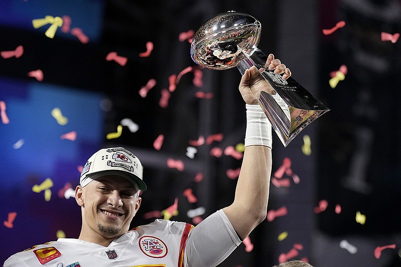 AP photo by Brynn Anderson / Kansas City quarterback Patrick Mahomes holds the team's Vince Lombardi Trophy after leading the Chiefs to victory against the Philadelphia Eagles in Super Bowl LVII on Sunday night in Glendale, Ariz. Mahomes was also named Super Bowl MVP for the second time, earning the honor three days after picking up the second league MVP award of his career.