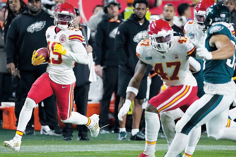 Kadarius Toney of the Chiefs returns a punt to get Kansas City in great field position during the second half Sunday night in Super Bowl LVII against the Eagles in Glendale, Ariz. (Associated Press)