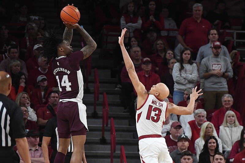 Razorbacks wing Jordan Walsh contests a three-point attempt during Arkansas' 70-64 loss to Mississippi State on Saturday, Feb. 11 2023, at Bud Walton Arena in Fayetteville.