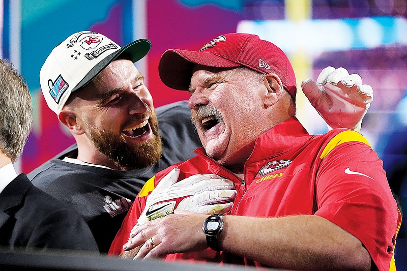 Chiefs tight end Travis Kelce and coach Andy Reid celebrate after Sunday night’s 38-35 win against the Eagles in Super Bowl LVII in Glendale, Ariz. (Associated Press)