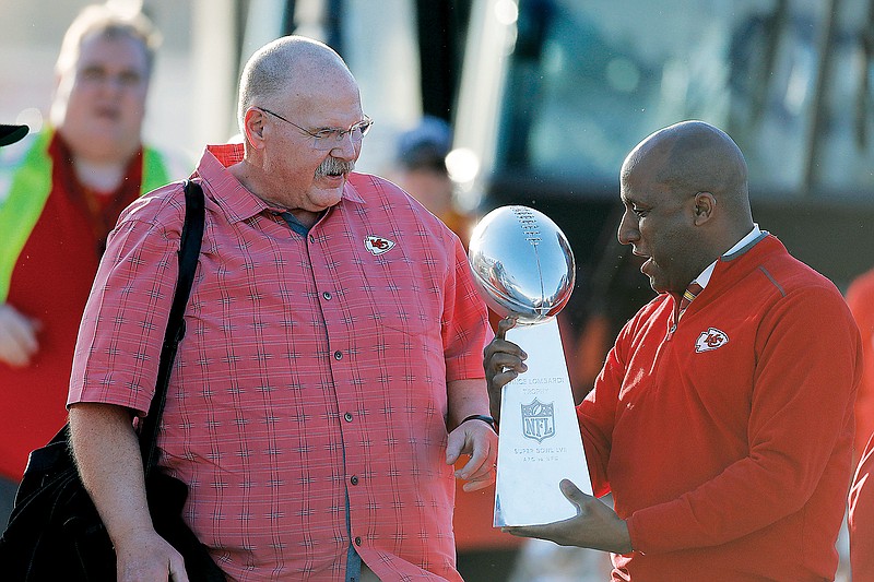 Chiefs coach Andy Reid hands the Vince Lombardi Trophy to Kansas City Mayor Quinton Lucas after the team returned home Monday in Kansas City. (Associated Press)