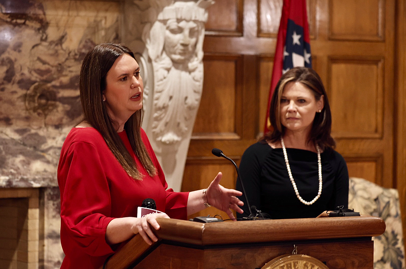 Gov. Sarah Huckabee Sanders and DHS Secretary Kristi Putnam speak at the state Capitol in Little Rock on Wednesday, Feb. 15, 2023. (Arkansas Democrat-Gazette/Tommy Metthe)