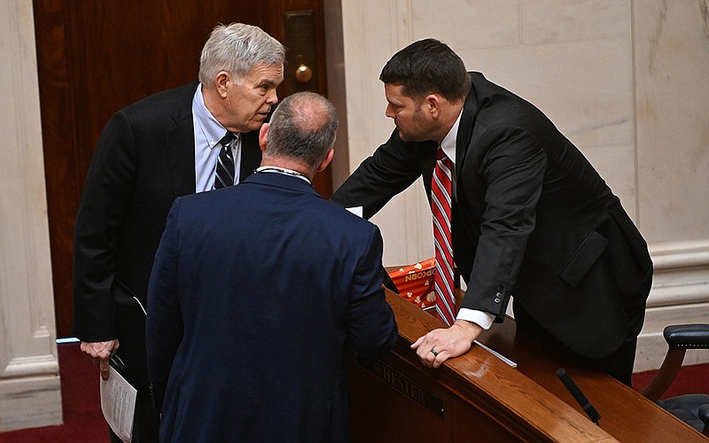 Sen. Dan Sullivan (left), confers with Senate President Pro Tempore Bart Hester (right) and Sen. Jimmy Hickey Jr. while other senators speak on Sullivan’s bill Thursday. After Hickey raised concerns, Sullivan agreed to amend the measure.
(Arkansas Democrat-Gazette/Staci Vandagriff)